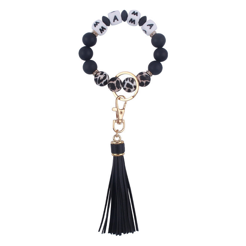 Venta al por mayor Llavero de muñeca con cuentas de estampado de leopardo de silicona